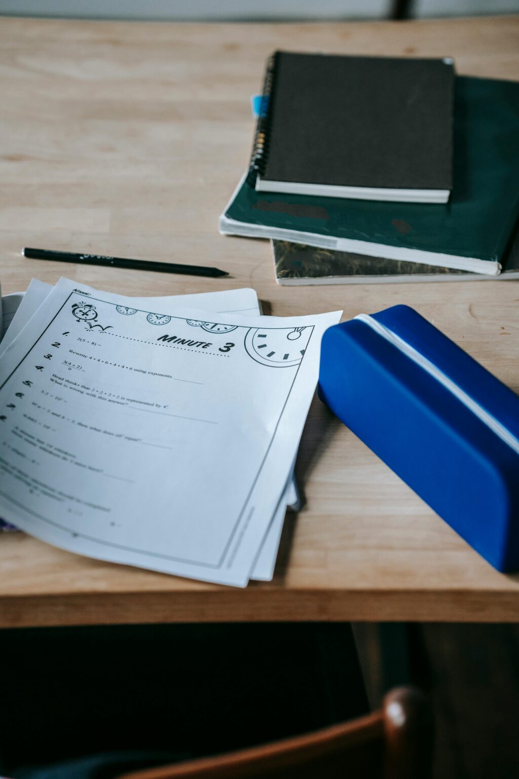 A neat arrangement of school supplies on a desk, ready for class.